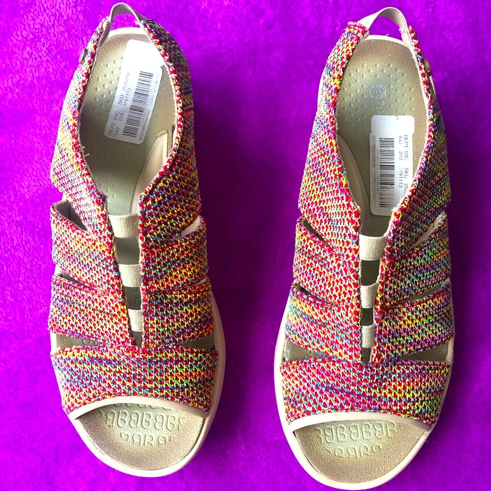 Slip on sandals with stretch strap at heel.